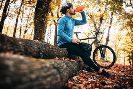 Man riding a bike and taking a break